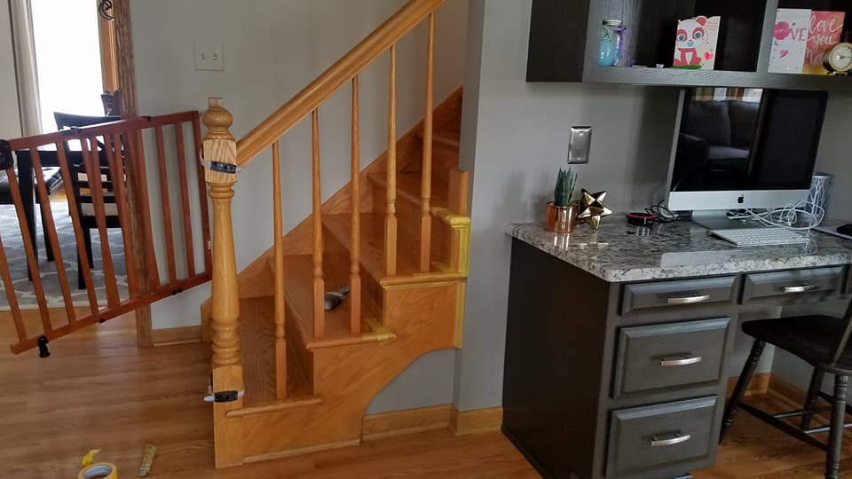 Before painting services of dark brown wooden desk with a light-colored countertop