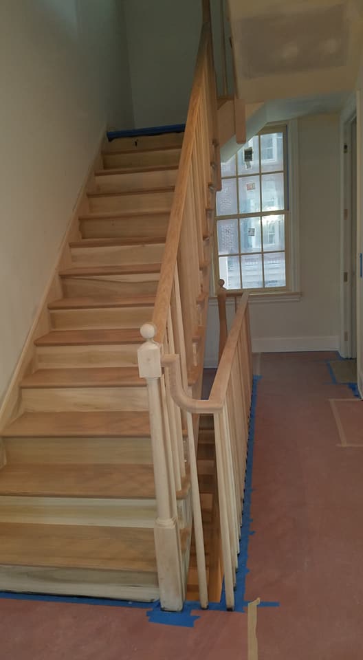 image shows wooden stairs before painting work